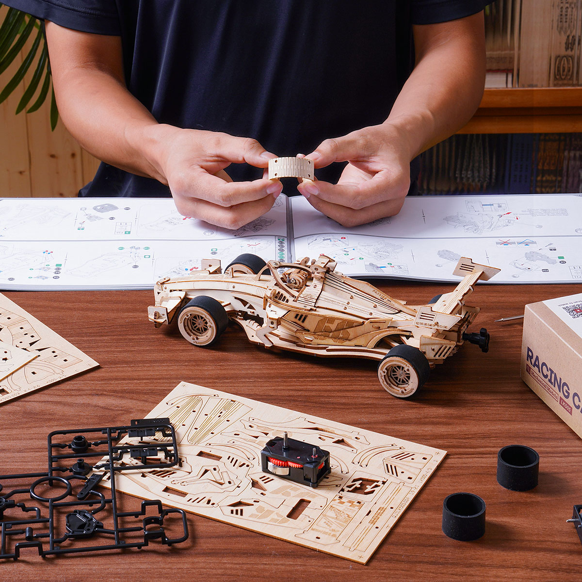 ROKR Racing Car LK505 assembly scene with tools, parts and manual