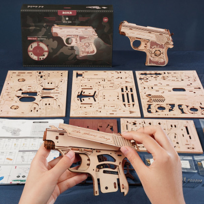 ROKR Mini Gun LQ502 scène d'assemblage avec feuilles de pièces et boîte de produit