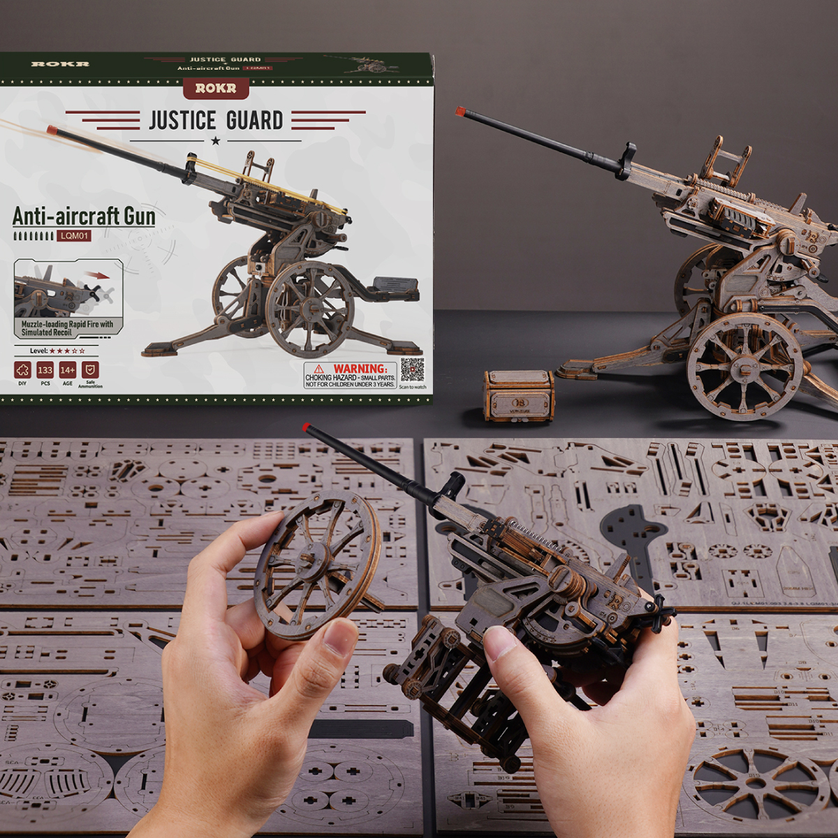 Scène d'assemblage de canon anti-aérien avec emballage, feuilles de bois et modèle
