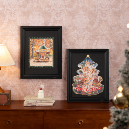 Christmas Town and framed companion puzzle displayed on cabinet