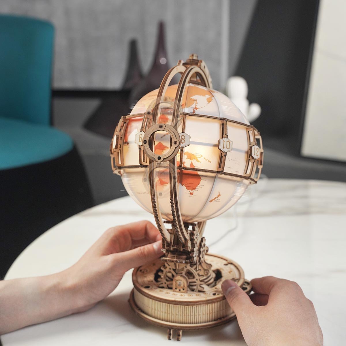 ROKR Luminous Globe ST003 hands placing globe model on table