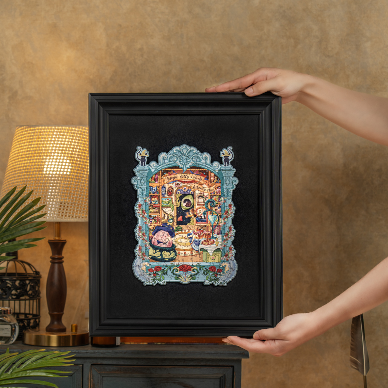 Magic Kitty's Home framed puzzle held in cozy room scene