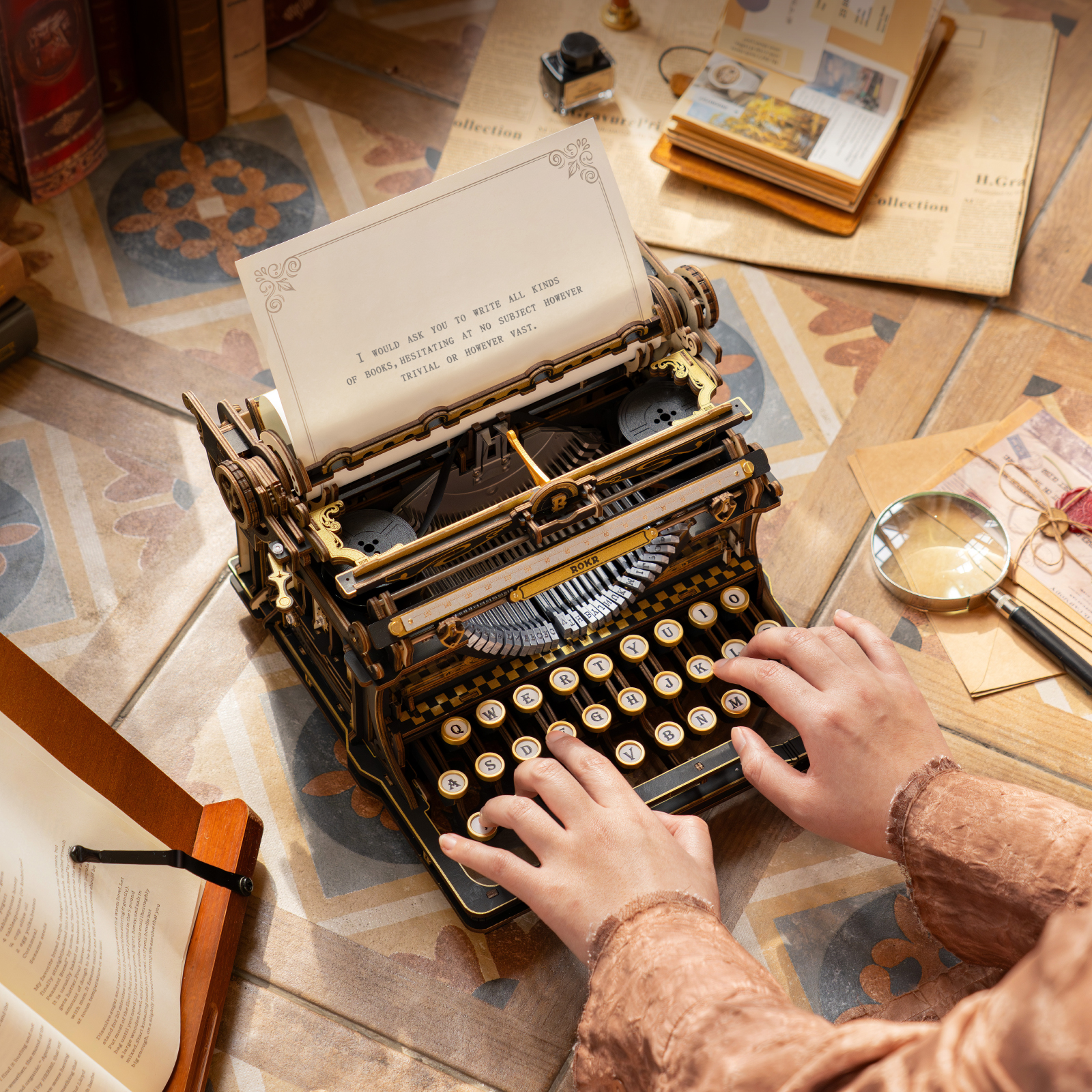 ROKR Mechanical Typewriter LK703B being typed in a warm desk scene