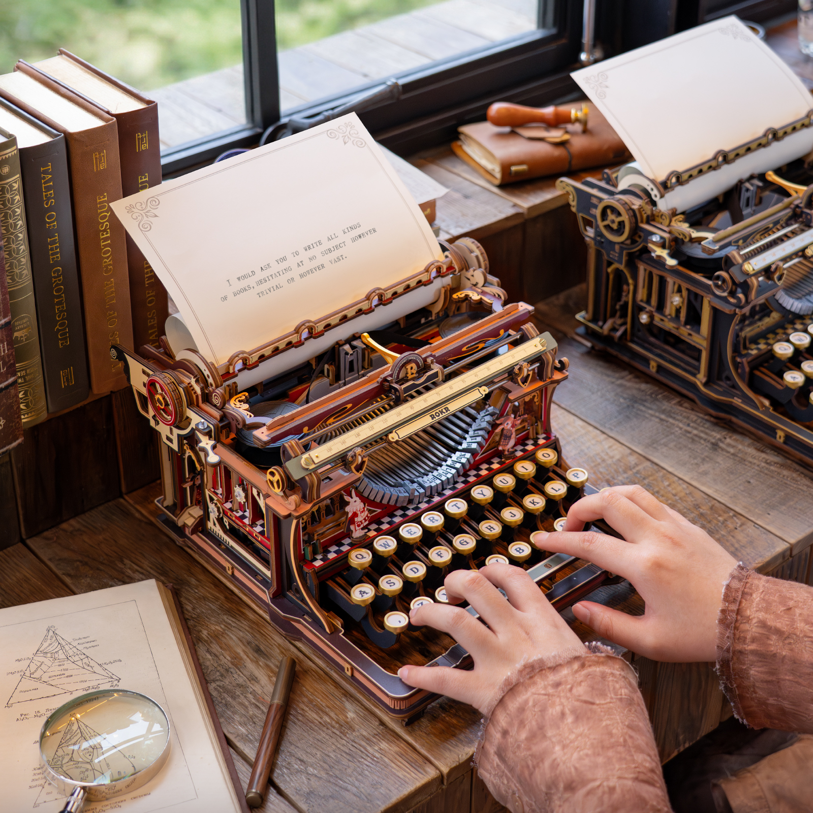 ROKR Mechanical Typewriter LK703C being typed beside a window