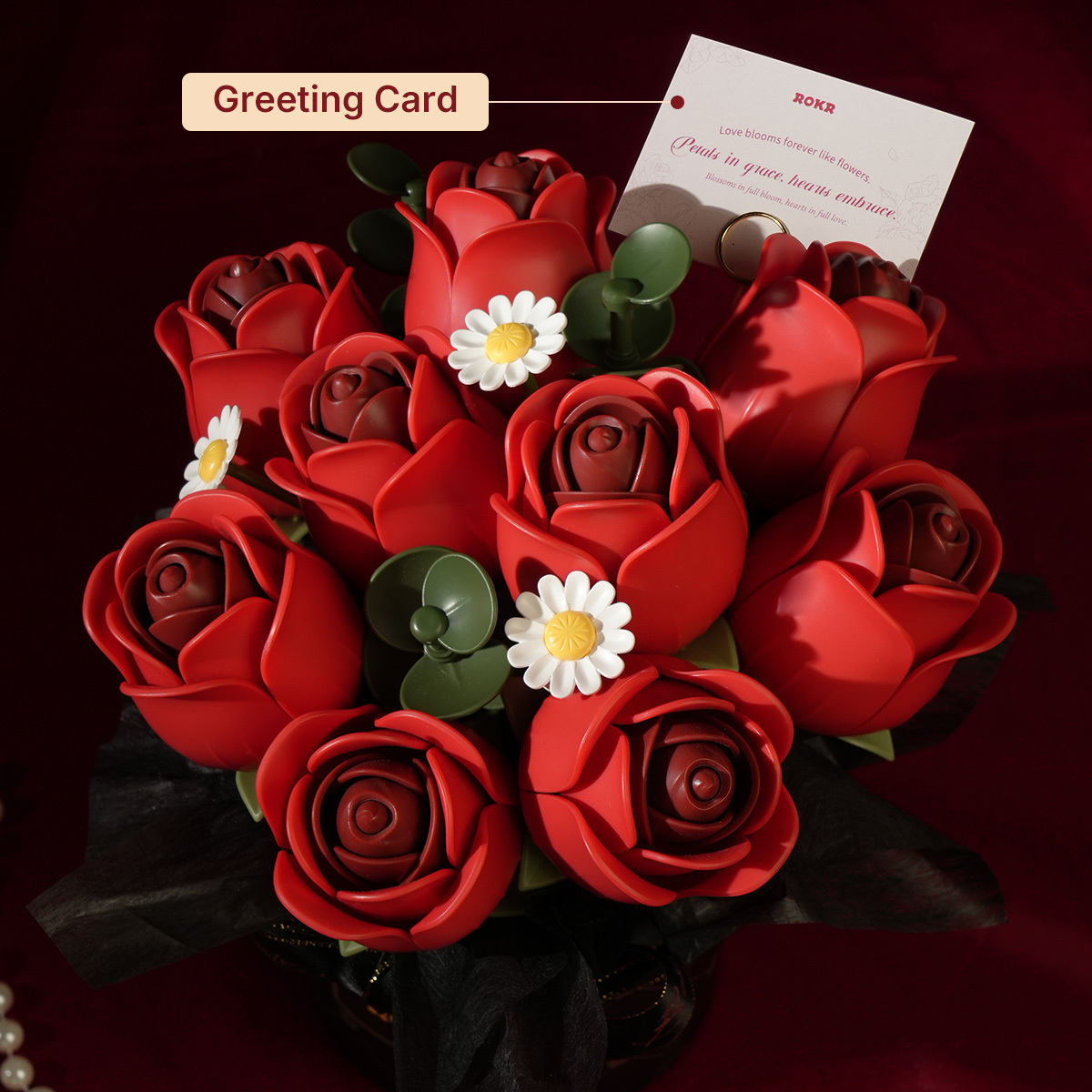 Red Rose Bouquet with greeting card in dramatic dark red scene