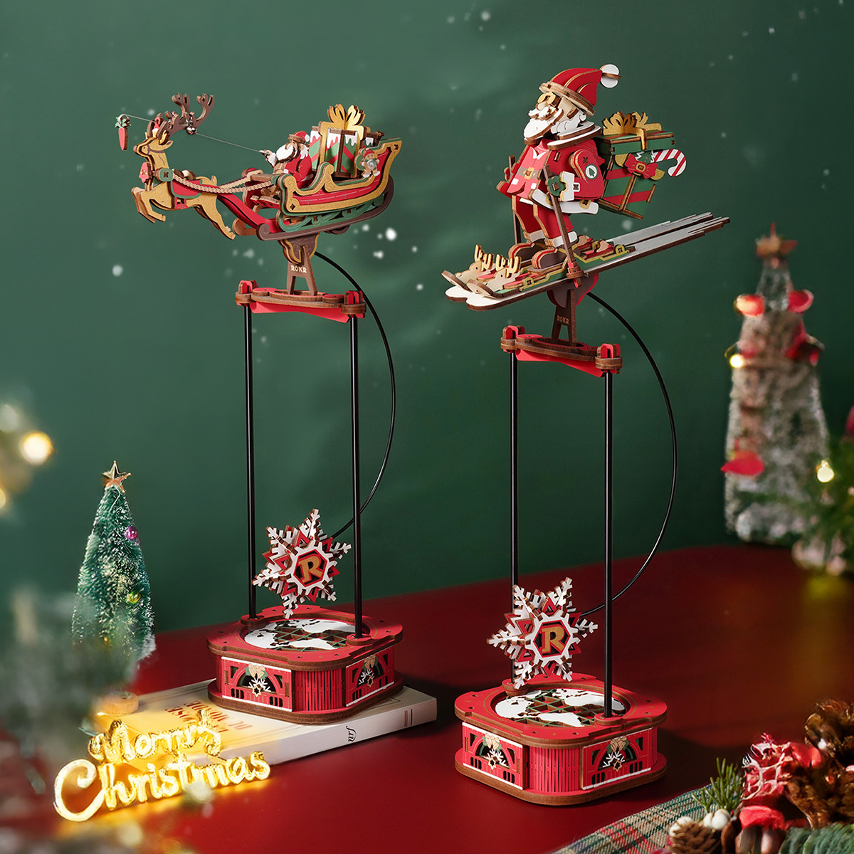 ROKR Gravity Swing Santa on Skis and Santa on Sleigh display pair