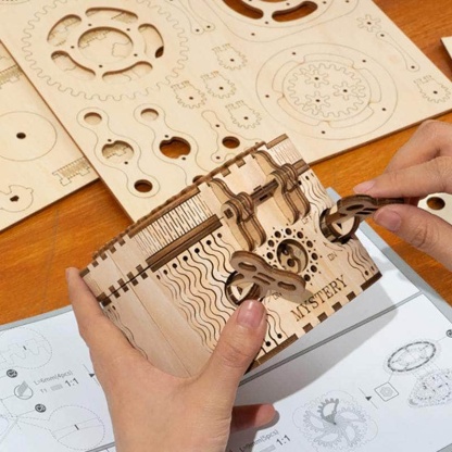 ROKR Treasure Box LK502 assembly close-up with hands opening the box