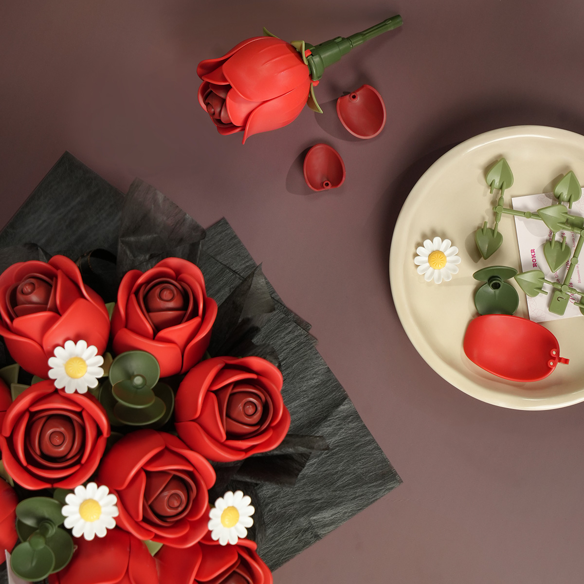 Red Rose Bouquet accessories and red rose petals arranged on table