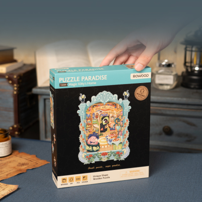 Magic Kitty's Home pakketdoos weergegeven naast ingelijste puzzel
