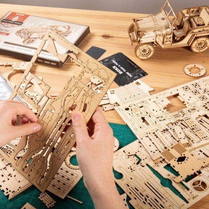 ROKR 1:18 Scale Model Army Jeep MC701 assembly scene with parts and tools