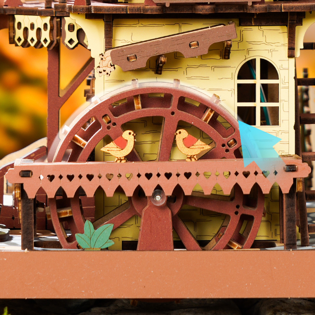 ROKR Cuckoo Clock close-up of rotating water wheel and bridge detail