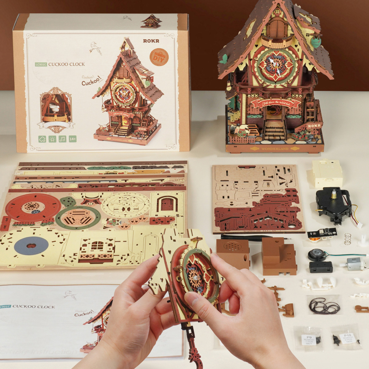 ROKR Cuckoo Clock assembly scene with wooden parts, manual and tools
