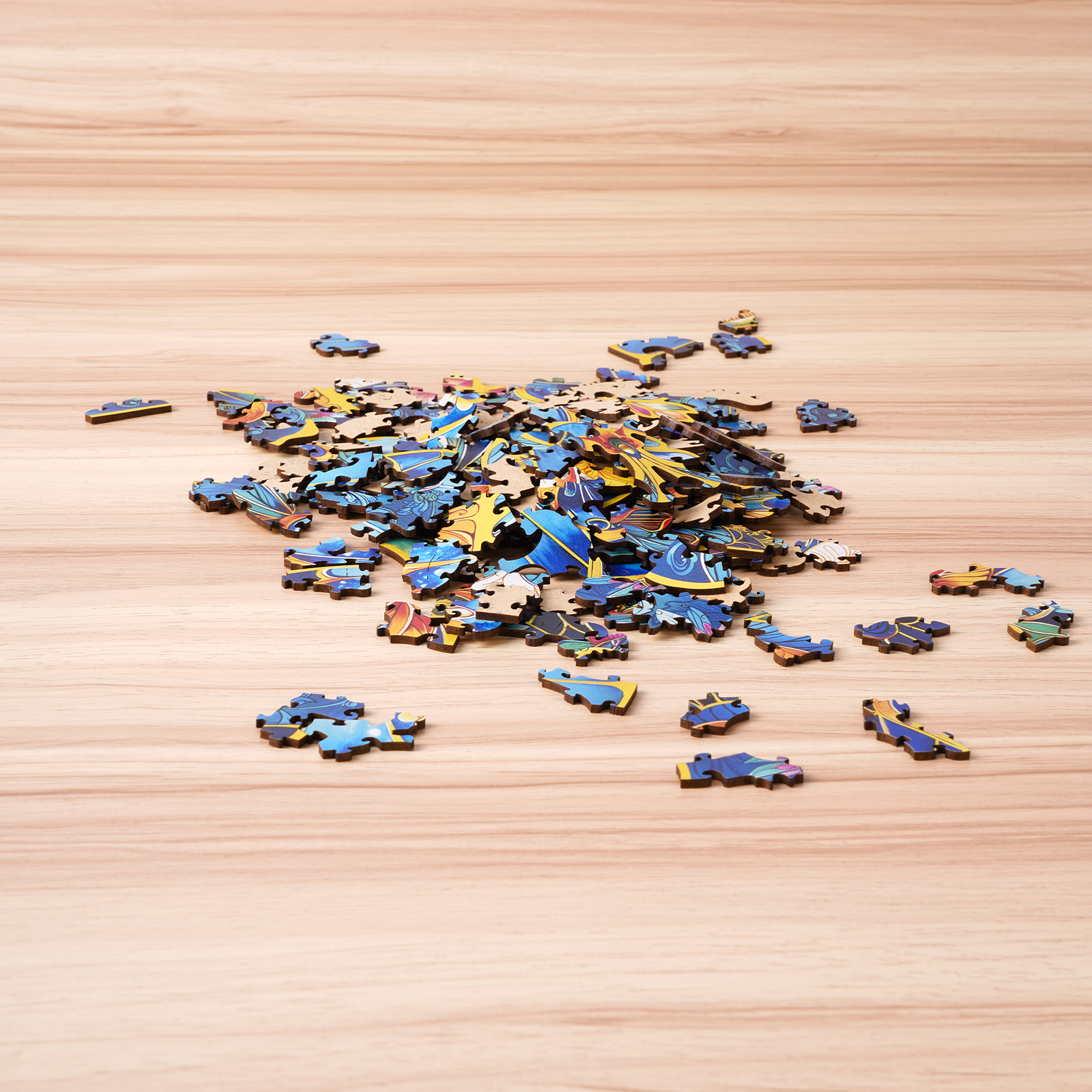 Rowood Morpho Helena scattered colorful wooden puzzle pieces on tabletop
