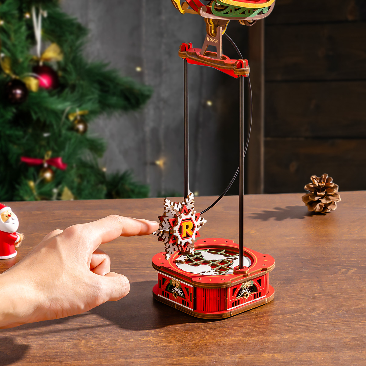 Santa on Sleigh pendulum base being pushed in festive scene