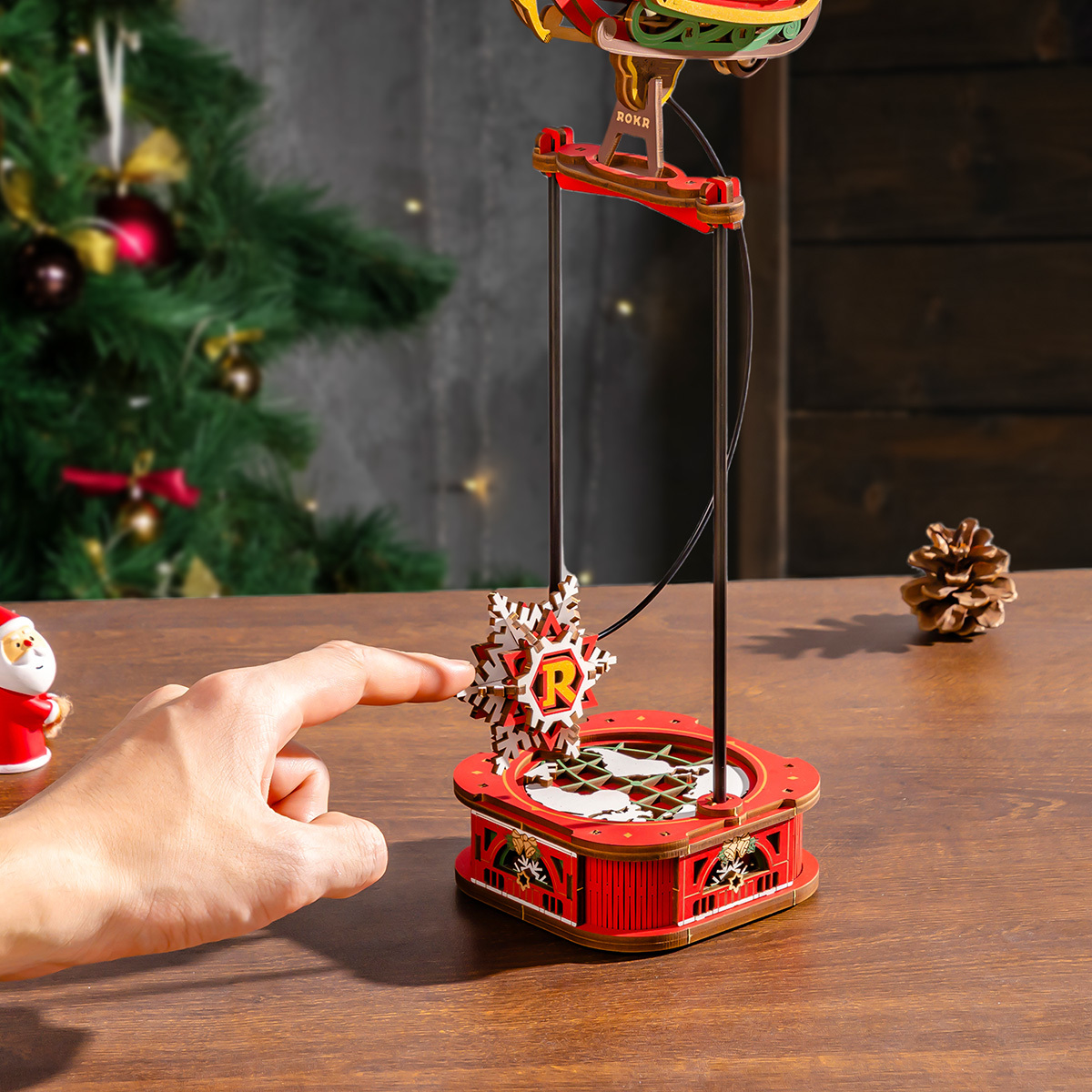 Santa on Sleigh pendulum base being pushed in festive scene