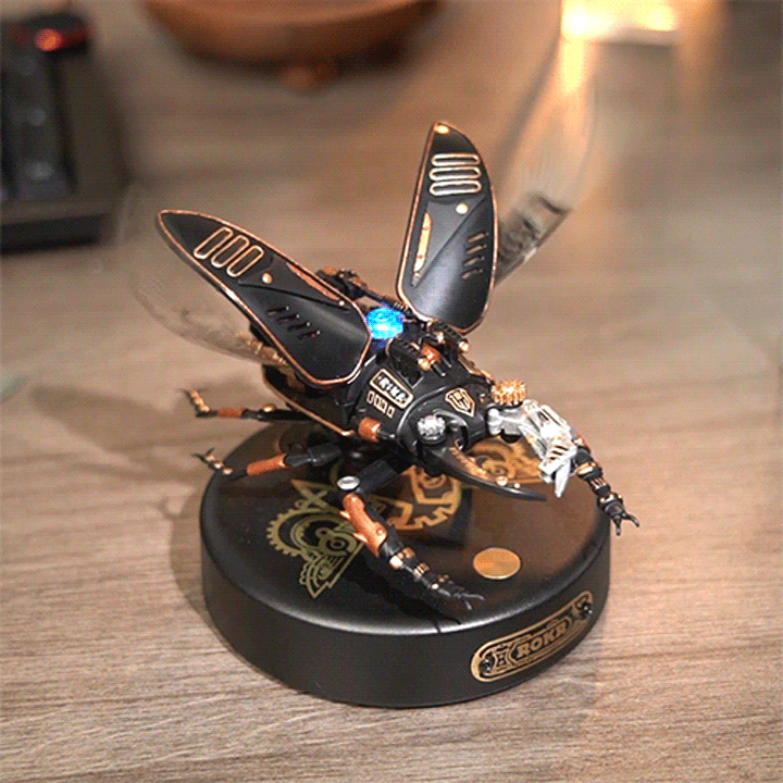 ROKR Storm Beetle MI03 black and blue mechanical beetle on display base