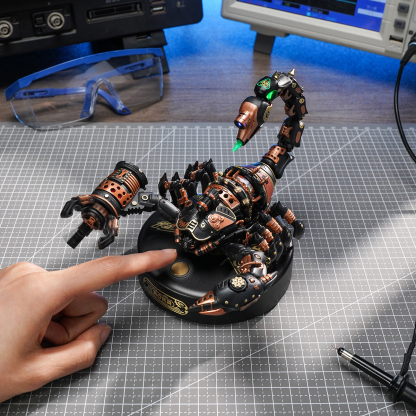 ROKR Emperor Scorpion MI04 workbench close-up with finger pointing