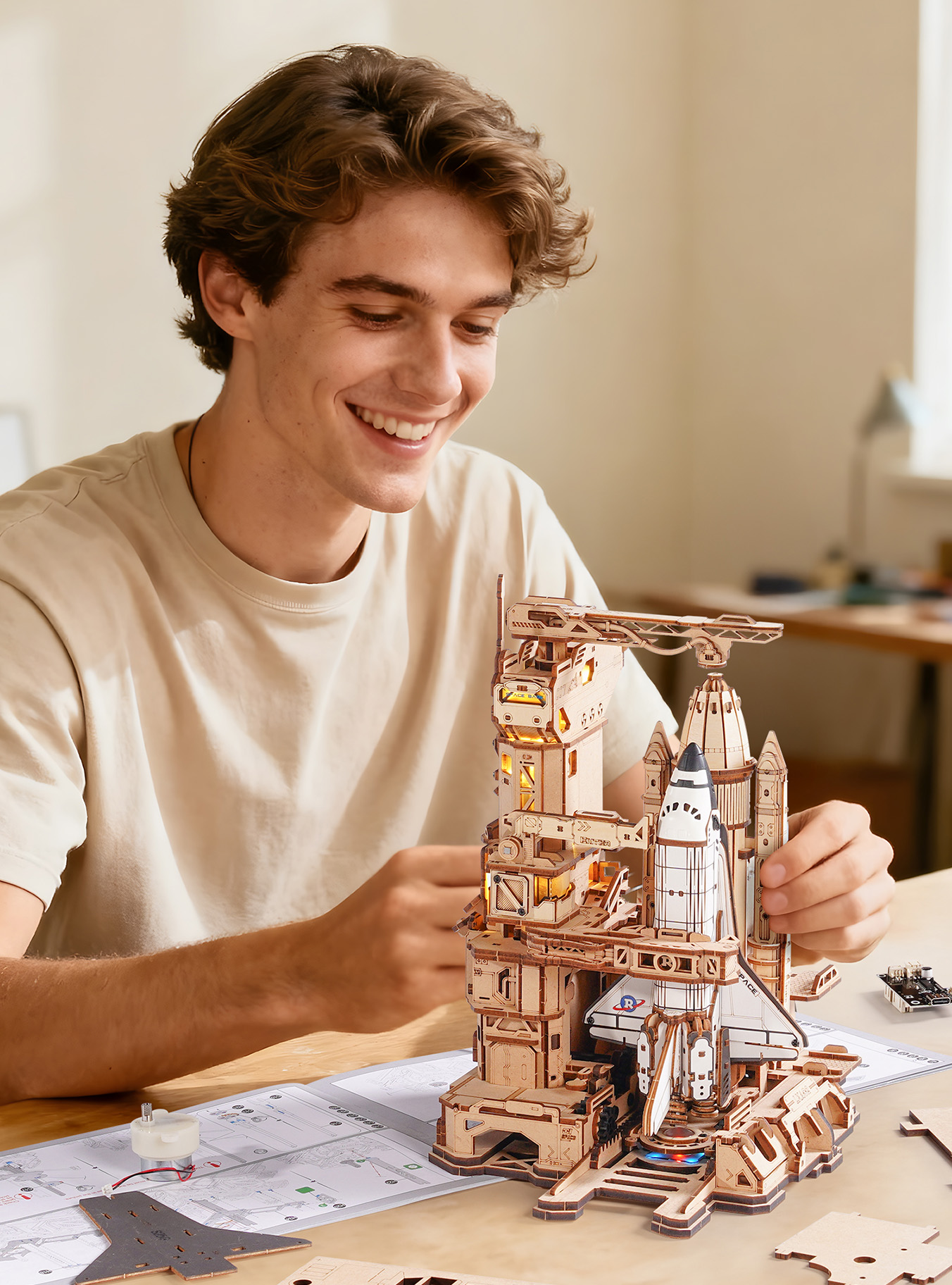 Builder holding a ROKR wooden model